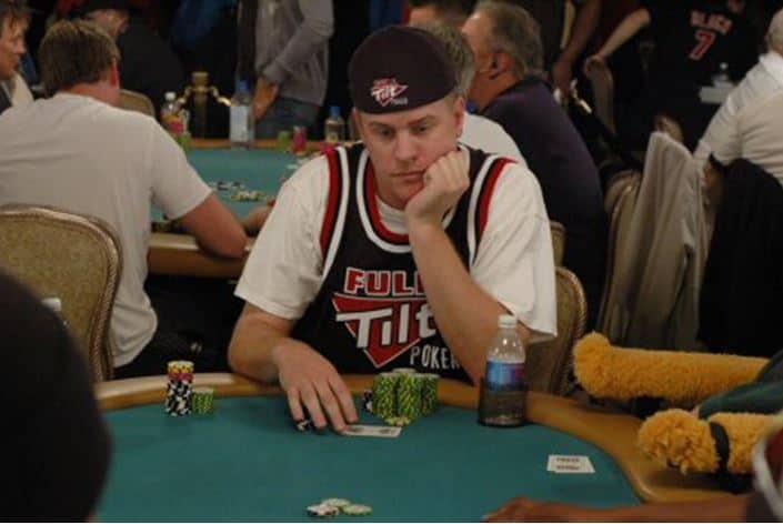 professional poker player Erick Lindgren sits at table