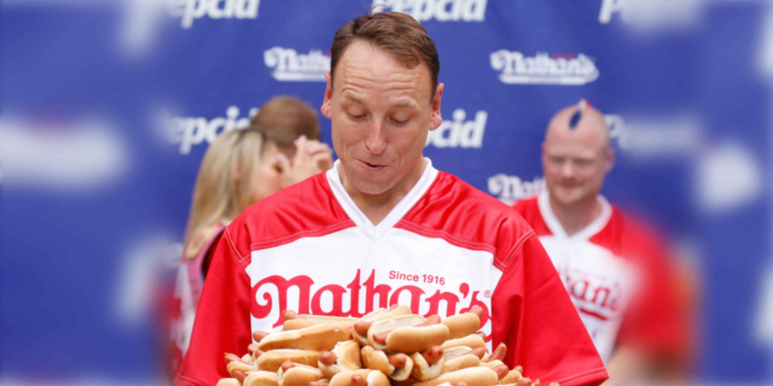 Joey Chestnut eating hot dogs
