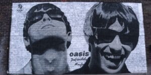 Oasis-Mural. Reunion tour begins in Cardiff