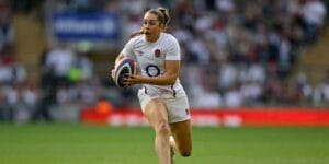 Holly Aitchison runs with the ball during a Six Nations rugby game between England and France.