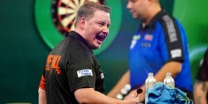 Martin Schindler celebrates beating Jermaine Wattimena at the World Darts Championship.