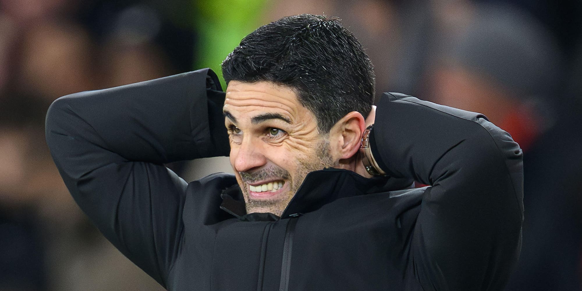 Mikel Arteta standing on the side line looking exasperated