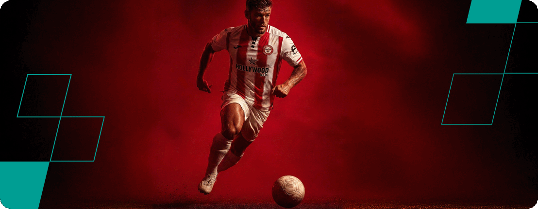 football player wearing brentford hollywoodbets jersey