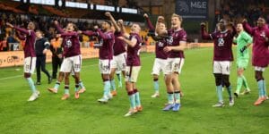 Burnley team celebrate winning against Wolves at Molineux