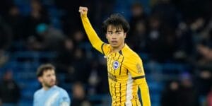 Kaoru Mitoma in the Brighton away shirt celebrating his goal against Manchester City