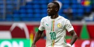 Sadio Mane playing for Senegal wearing a white football shirt