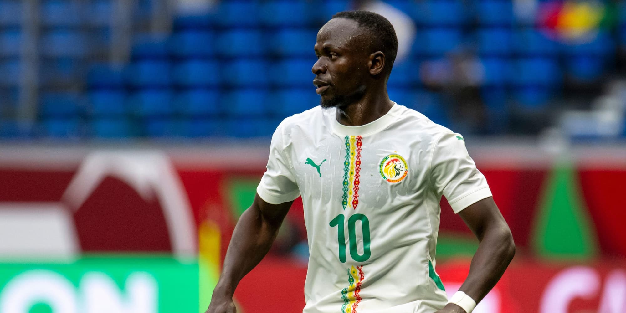 Sadio Mane playing for Senegal wearing a white football shirt