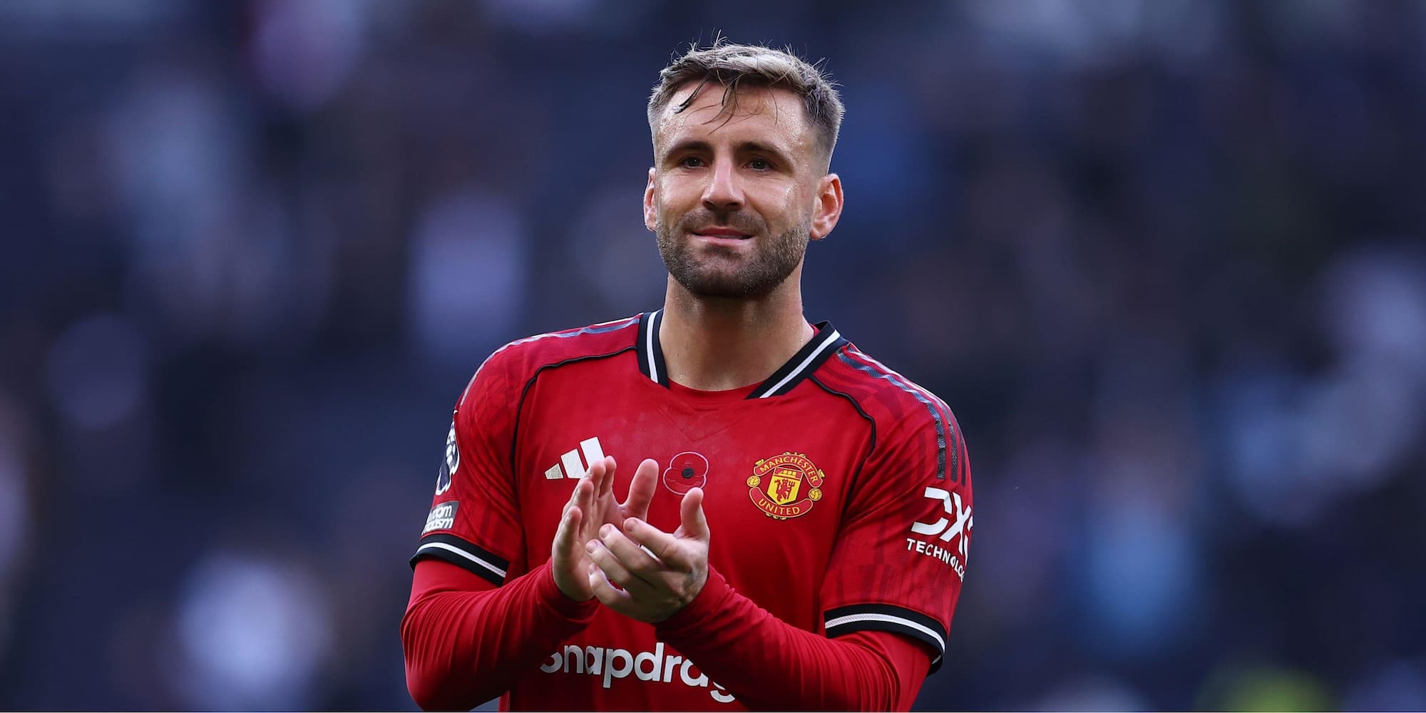 Luke Shaw playing for Manchester United playing in their red home strip