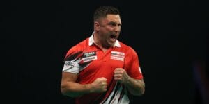 Gerwyn Price celebrates on stage in the Premier League