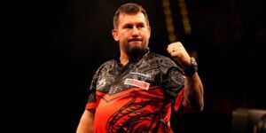 Jonny Clayton celebrates on stage after another win in the 2026 Darts Premier League