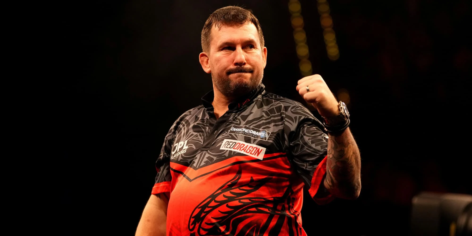 Jonny Clayton celebrates on stage after another win in the 2026 Darts Premier League