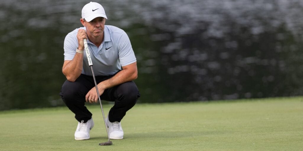 Rory McIlroy looks over a putt when playing in the Truist Championship on the PGA Tour