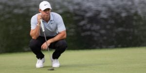 Rory McIlroy looks over a putt when playing in the Truist Championship on the PGA Tour