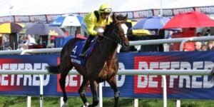 Rahiebb cantering to post under Ray Dawson