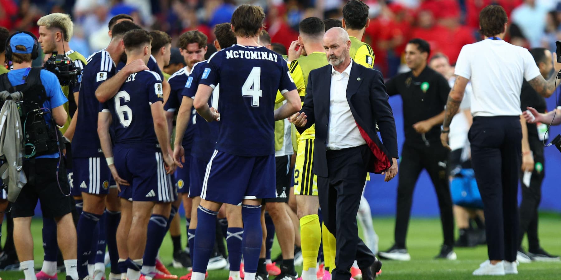 Steve Clarke and the Scotland World Cup team after defeat